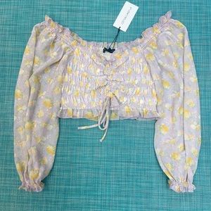 purple and yellow long sleeve top